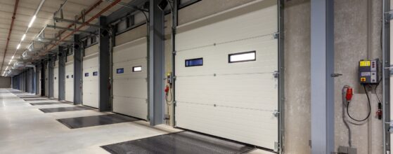 Inside of a warehouse with a row of loading bays
